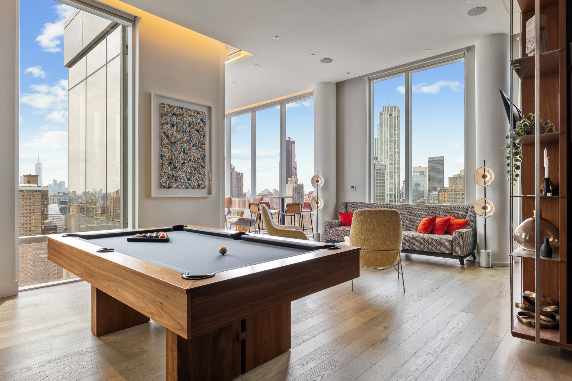 Game room with billiards and skyline views