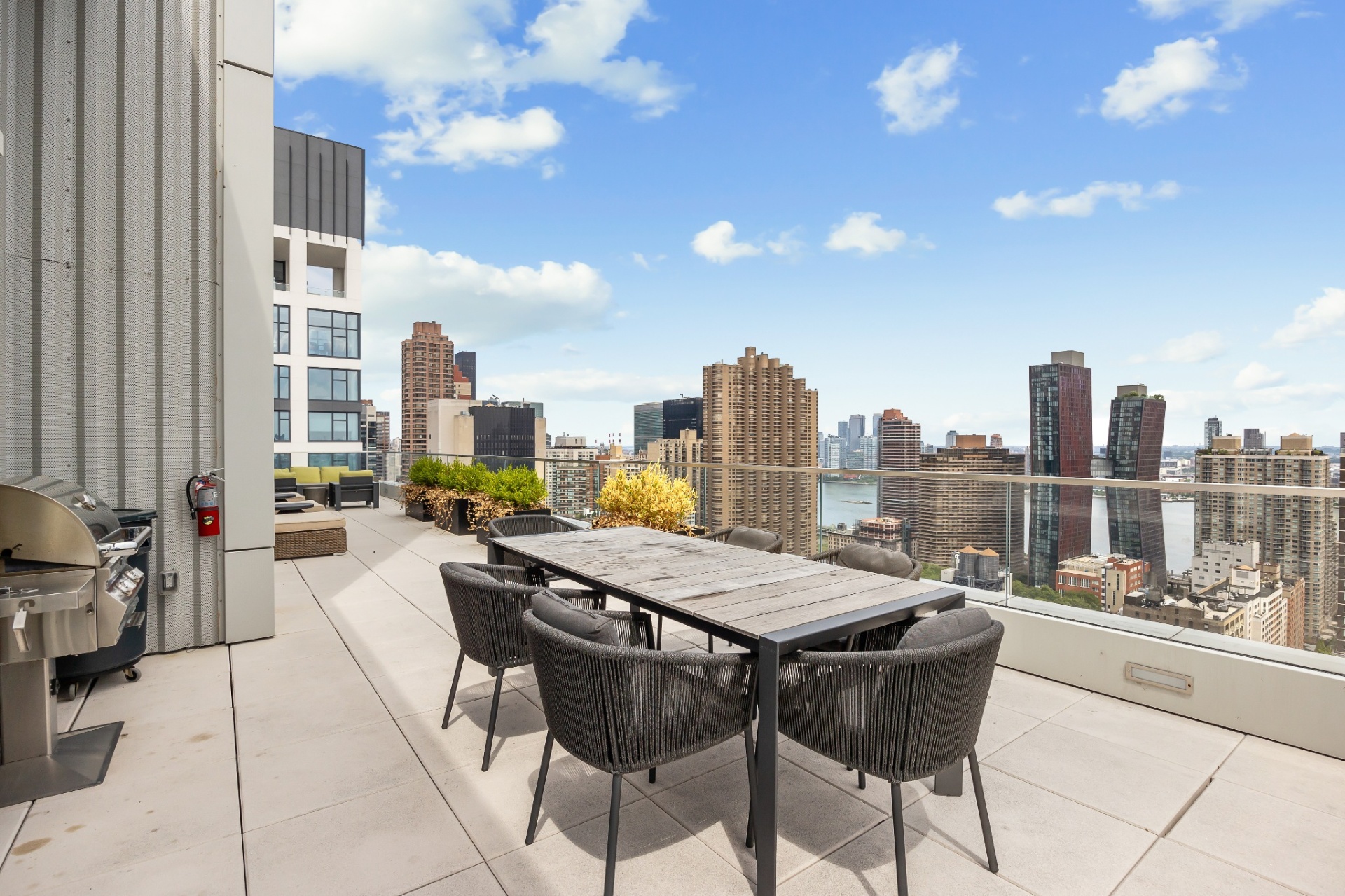 Outdoor terrace dining with East River views